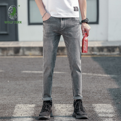七匹狼国际公司授权WOLFTREK-男装2021春款牛仔裤男士韩版潮流修身潮牌百搭小脚长裤男弹性5106外景
