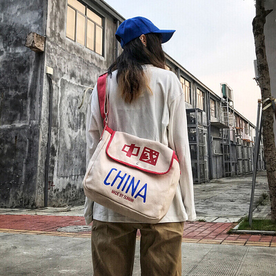 新款潮流原宿街头潮酷嘻哈滑板男生情侣女包撞色帆布包斜挎单肩包-定制玫红色玫红色