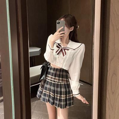 YIBUSHENG2021春装新款双排扣蝴蝶结领带长袖衬衫+高腰百褶格子半身裙套装